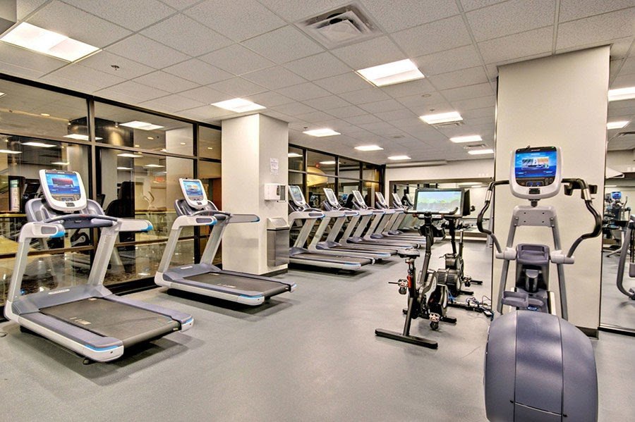 Fitness room with treadmills and bikes at the evo residence